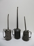 Three long spout oil cans, 13