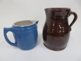 Two stoneware pitchers