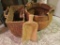 Two wicker baskets and large wood scoop