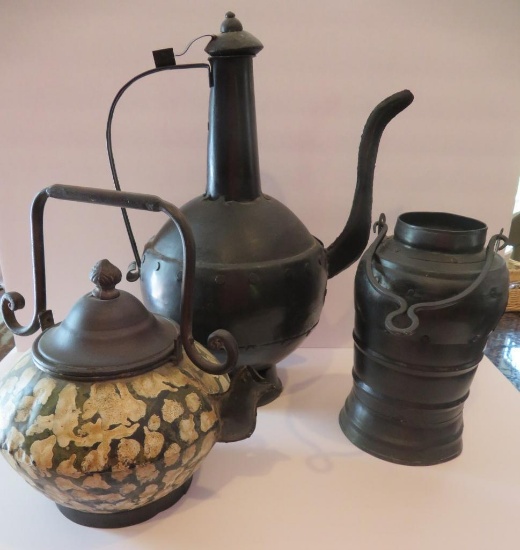 Three pieces of decorative metal ware, pots and ewer, 10" to 18"