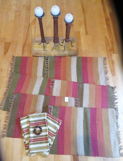 Six earth tone woven placemats, three napkins, wood tray and candle holders