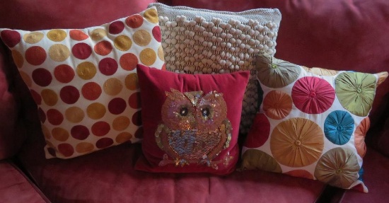 Four decorative accent pillows, 13" to 17"