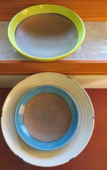 Three earthenware bowls, 10", 12" and 14 1/2"