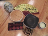 Oriental cooking items, black dinner plates and table decor