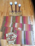 Six earth tone woven placemats, three napkins, wood tray and candle holders