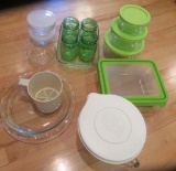 Glass storage containers and three green pint jars
