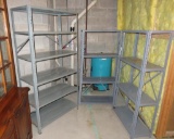 Three metal storage shelves