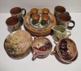 Assorted decorative dishes, mugs, egg cups, plates, two different designs
