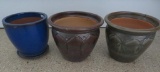 Three ceramic flower pots, 12