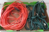 Five extension cords, four outdoor Christmas and one orange about 75'