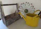 Yard art, metal flower, yellow sprinkle can and wood carrier