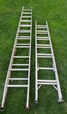 Two aluminum extension ladders