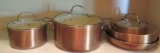 Four Food Network copper finish kettles and one Epicurean skillet