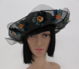 Lovely black netting mesh hat with velvet and staw flowers