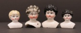 Four china doll heads for small dolls or pin cushion tops, 2