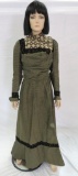 Two piece lady's dress, patterned with lace and velvet trims