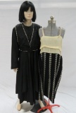 Two piece black dress with embellishments and patterned bottom under dress