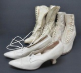 Three pair of white leather shoes and boots