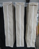 Three cloth garment storage bags with cedar inserts