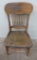 Schlitz press carved back tavern chair