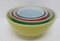 Four bowl nest of colored Pyrex bowls, yellow=green-red and blue