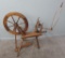 Vintage spinning wheel with distaff