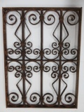 Ornate cast iron window grate, 22