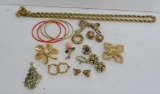 Gold tone vintage jewelry lot with Trifari and Monet Pin and various unmarked pins and earrings