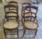 Four caned seat ladder back chairs, four styles all similiar