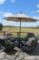 Four Windham rocking metal patio chairs with outdoor cushions, table and 8' umbrella