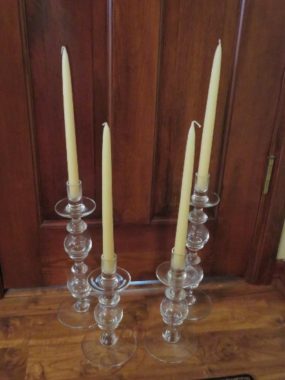Two sets of glass candle holders, 10" and 14"