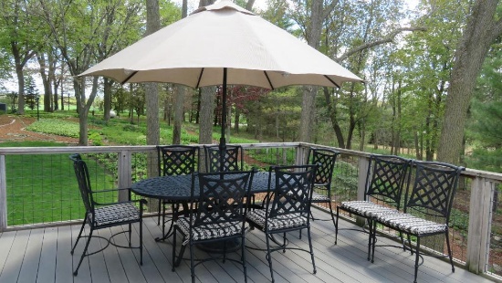 Very nice metal Windham patio set with 8 chairs and umbrella