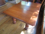 Gorgeous oak five legged dining table with five leaves and pads