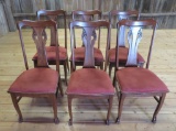Six lovely carved oak T back chairs paw feet