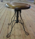 Ornate metal base and twisted leg adjustable round top stool