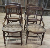 Set of four cane seat chairs with hip rest design