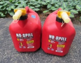 Two 5 gallon plastic gas cans, both full of gas