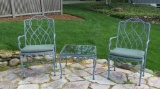 Two heavy metal outdoor patio chairs with 24