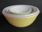 Nest of three pyrex bowls and white milk glass mixing bowl