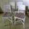 Set of Four white wicker chairs