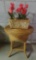 Round wicker side table and tulip arrangement in basket