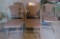 Five metal folding chairs, four are a set and extra Samsonite