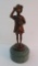 Bronze patina figure of little girl, 11