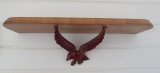 Wooden shelf with cast iron eagle bracket