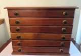 Walnut six drawer spool style cabinet, 21