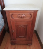 Marble top bedside table with carving, 19