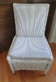 Nice wicker side chair with blue and white pillow ticking cushions, 19
