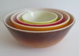 Nest of four multi color pyrex mixing bowls