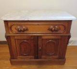 Beautiful walnut marble top commode, fruit pulls on drawer and two doors, 33