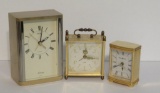 Three metal travel clocks, Seiko, Howard Miller and Germany, 2 3/4